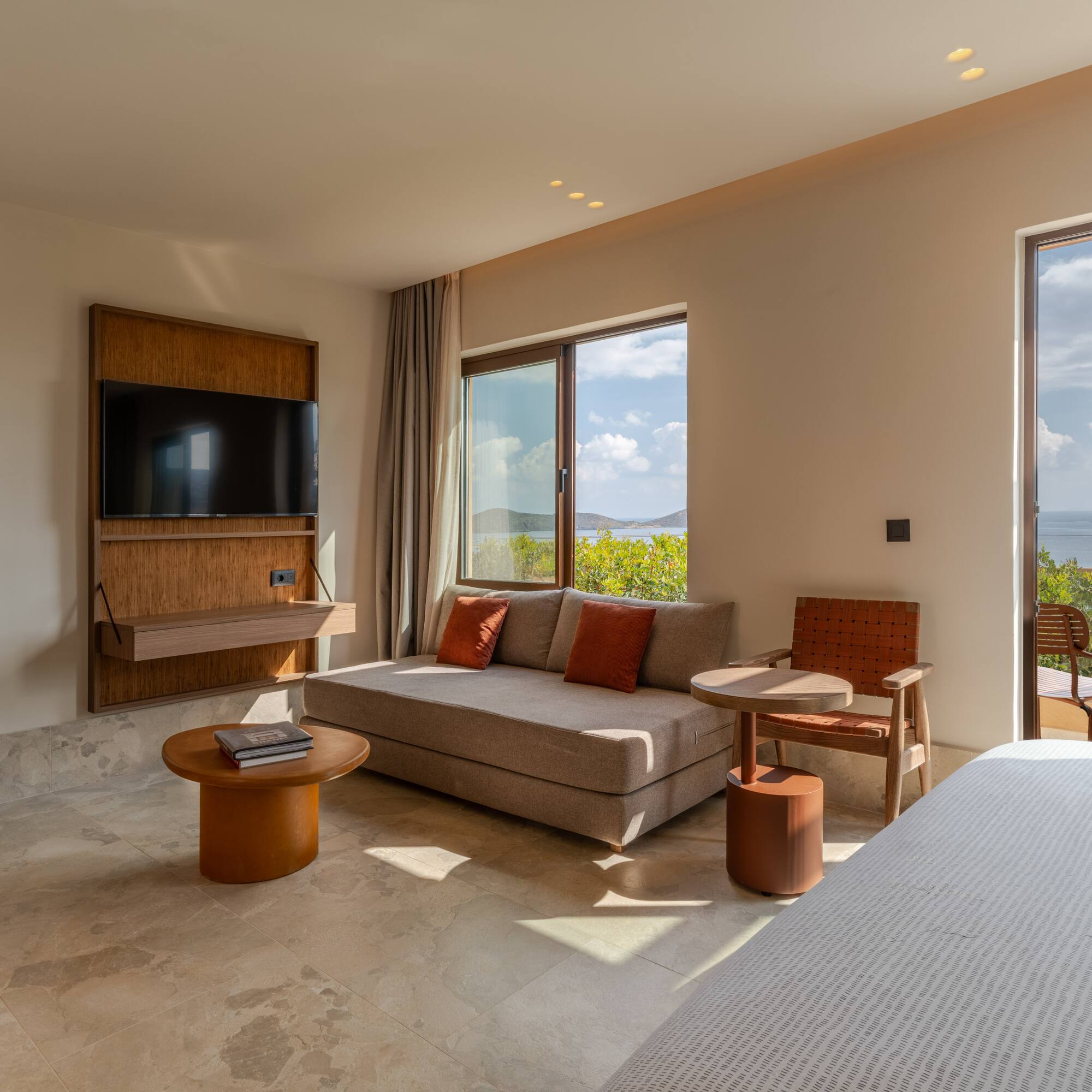 a room with a bed and a television