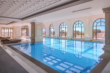 a indoor swimming pool with windows