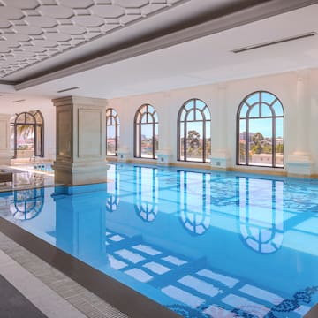 a indoor swimming pool with windows