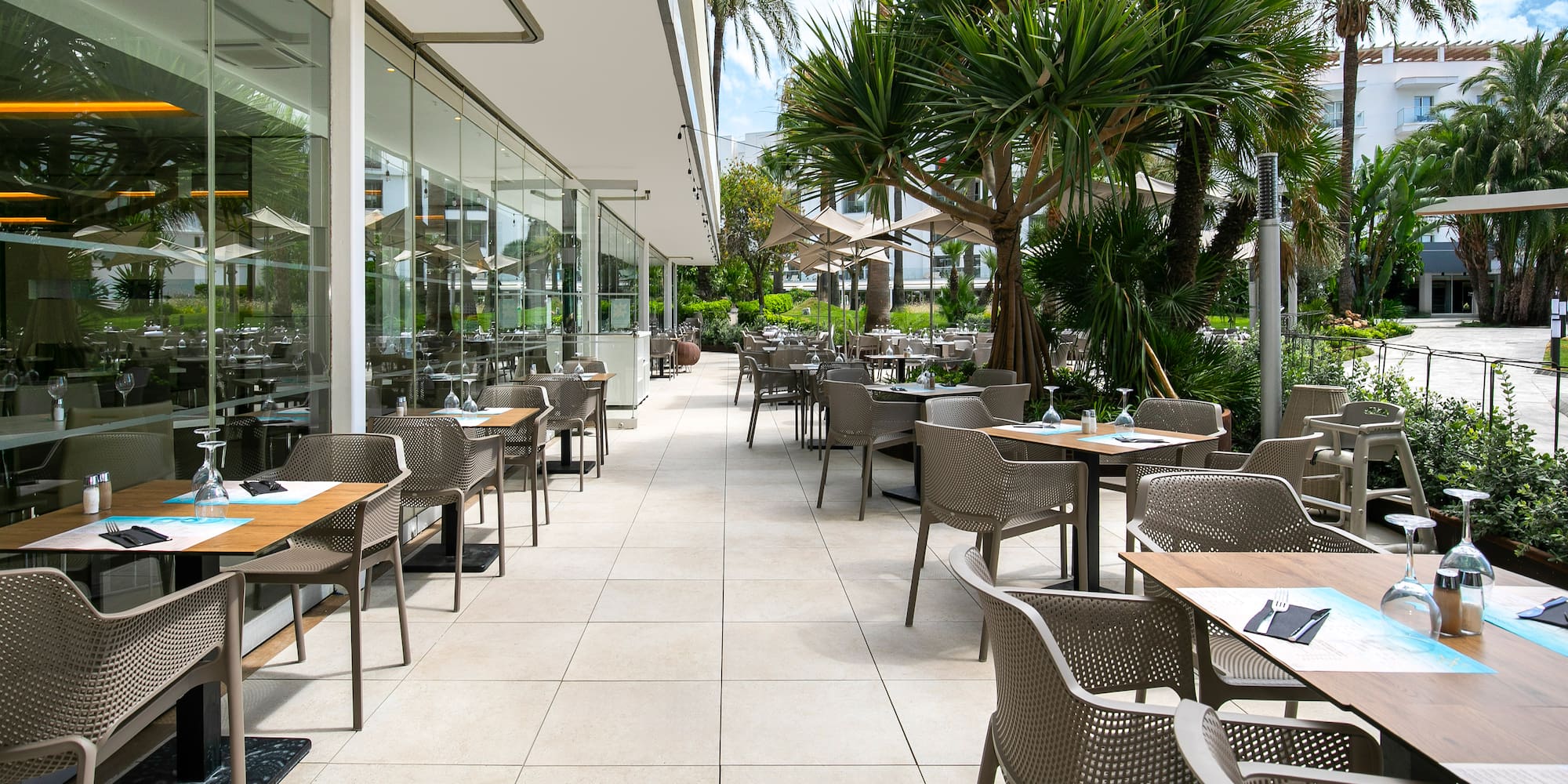 a patio with tables and chairs
