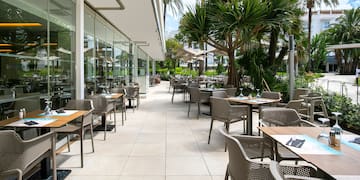 a patio with tables and chairs