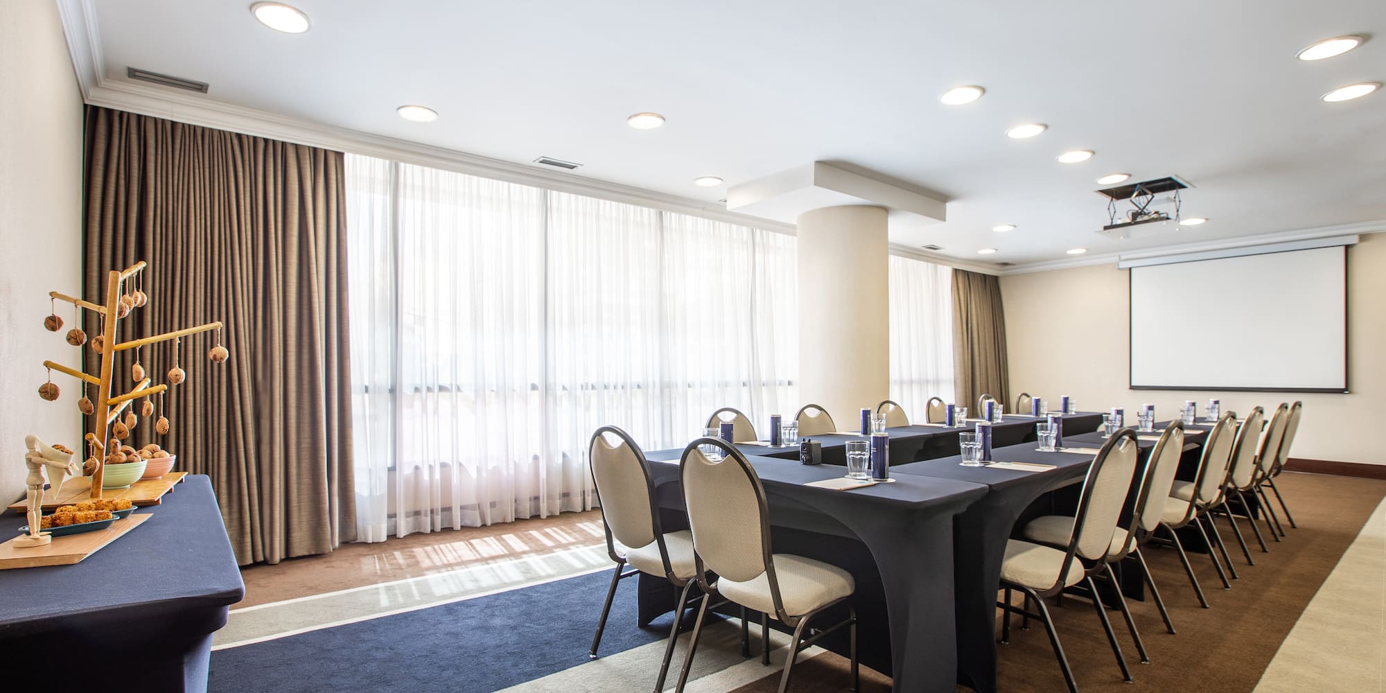 a room with a large table and chairs