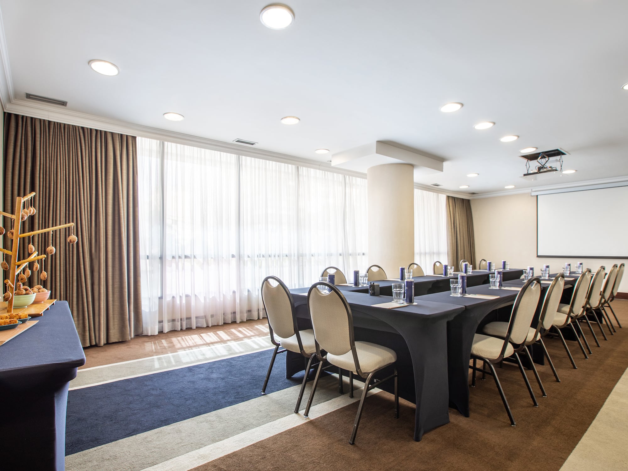 a room with a large table and chairs