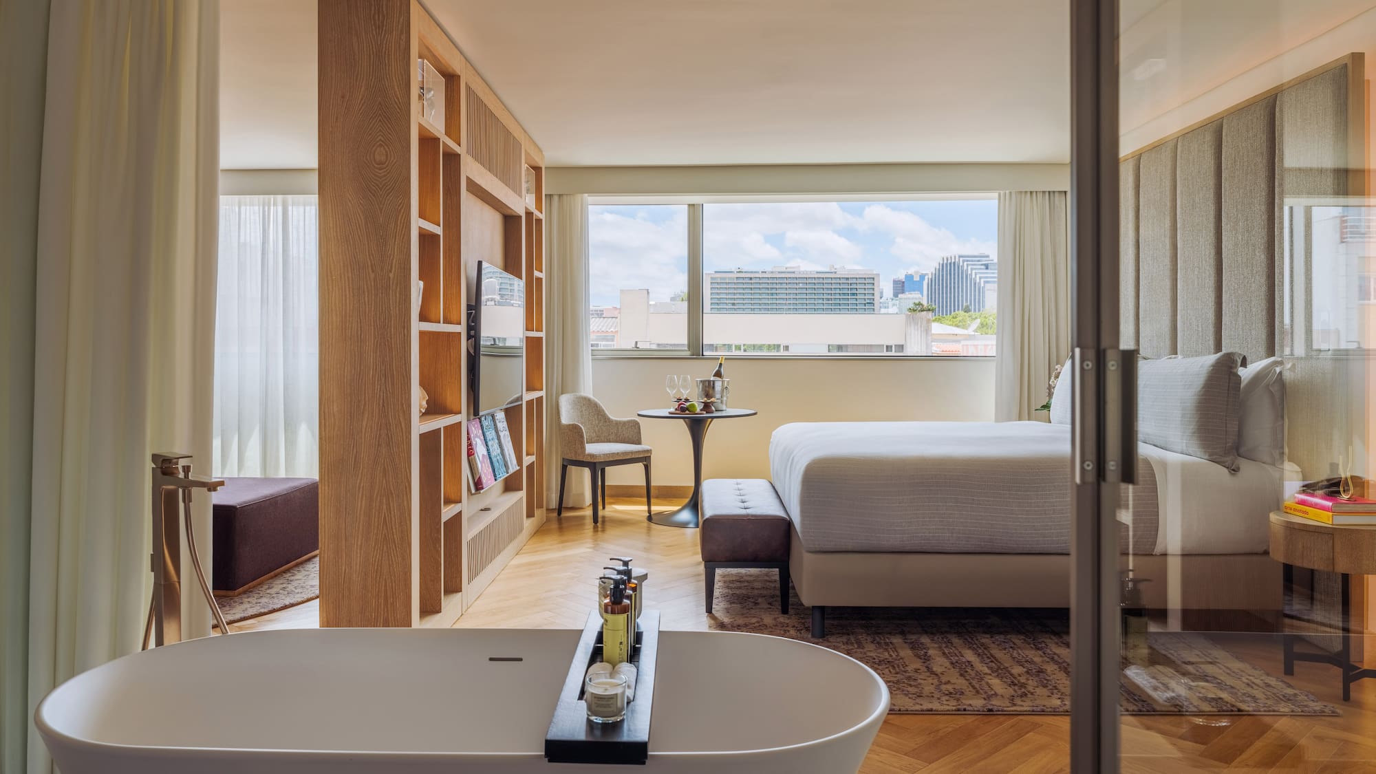 a room with a bed and a bathtub