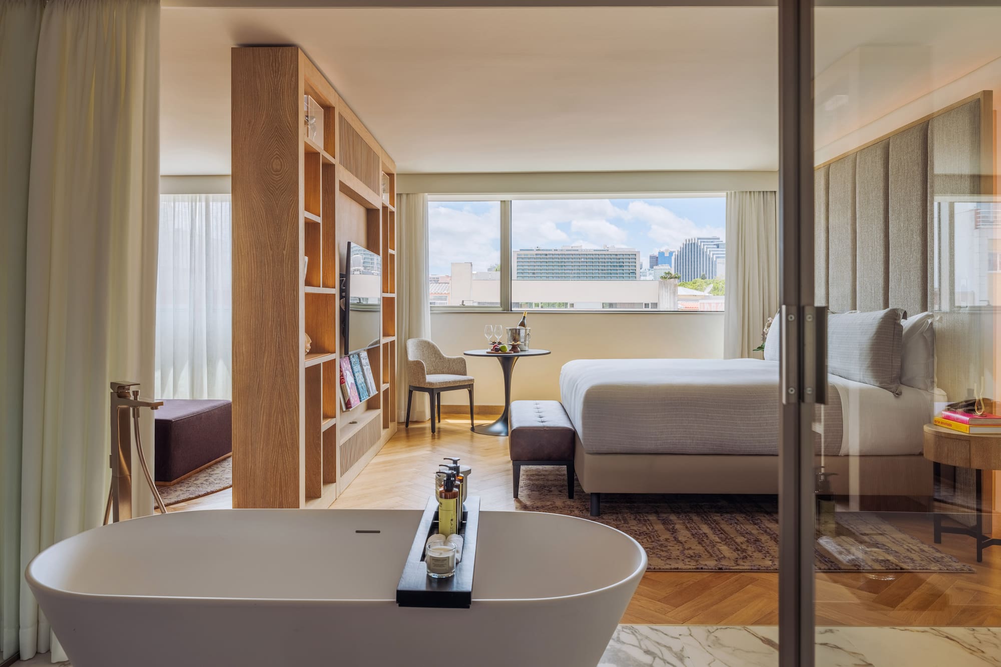 a room with a bed and a bathtub