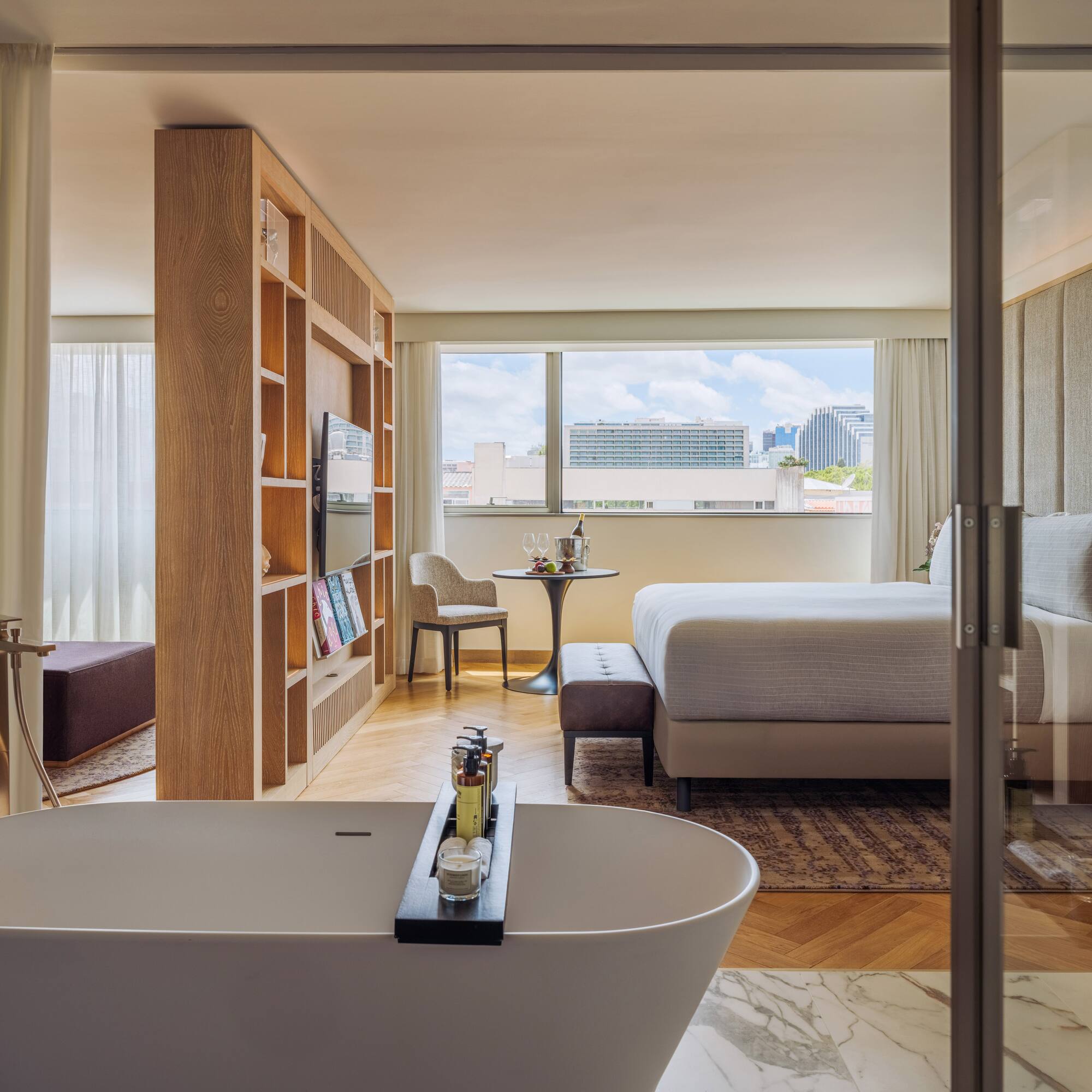 a room with a bed and a bathtub