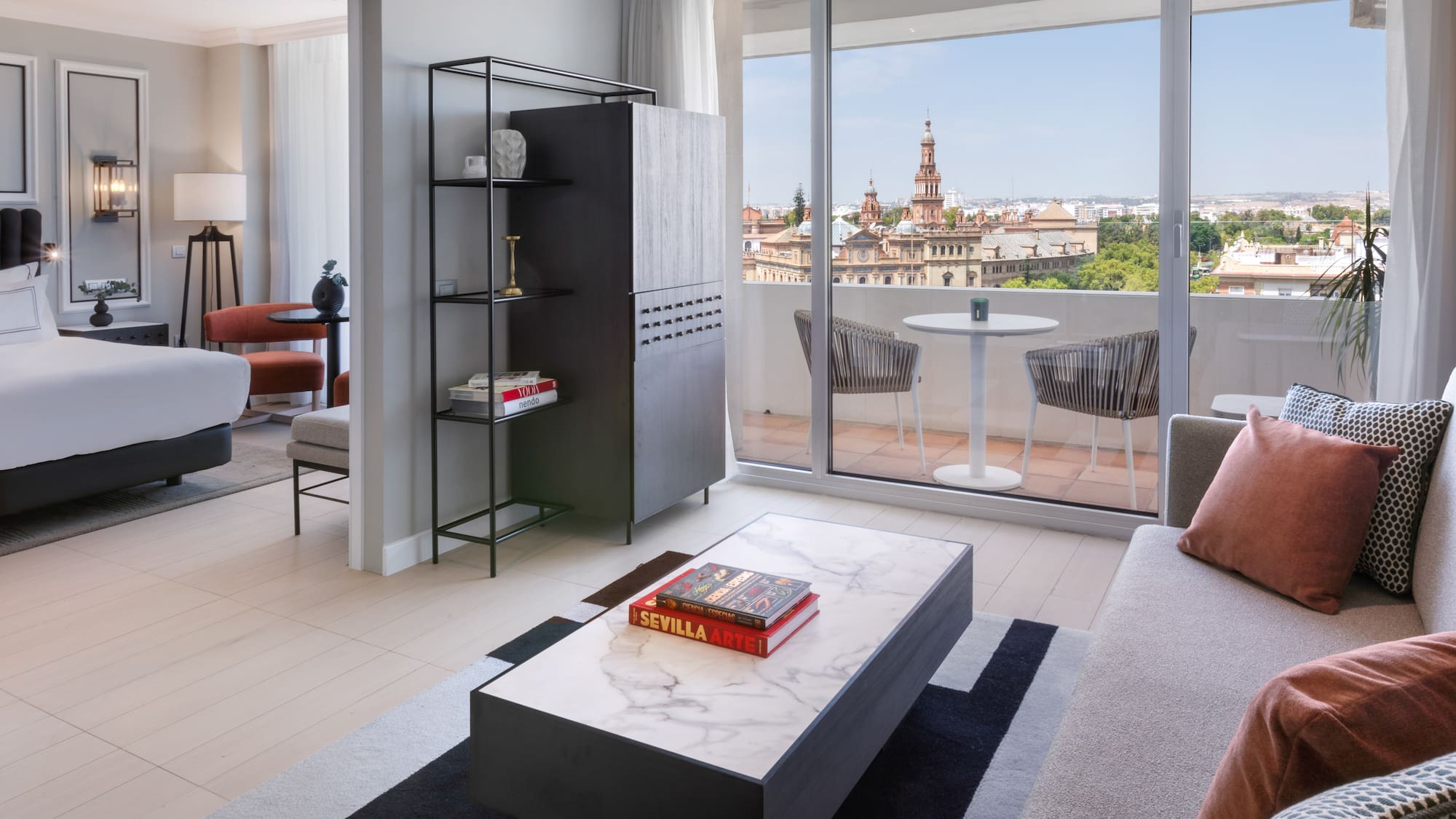 a living room with a table and chairs