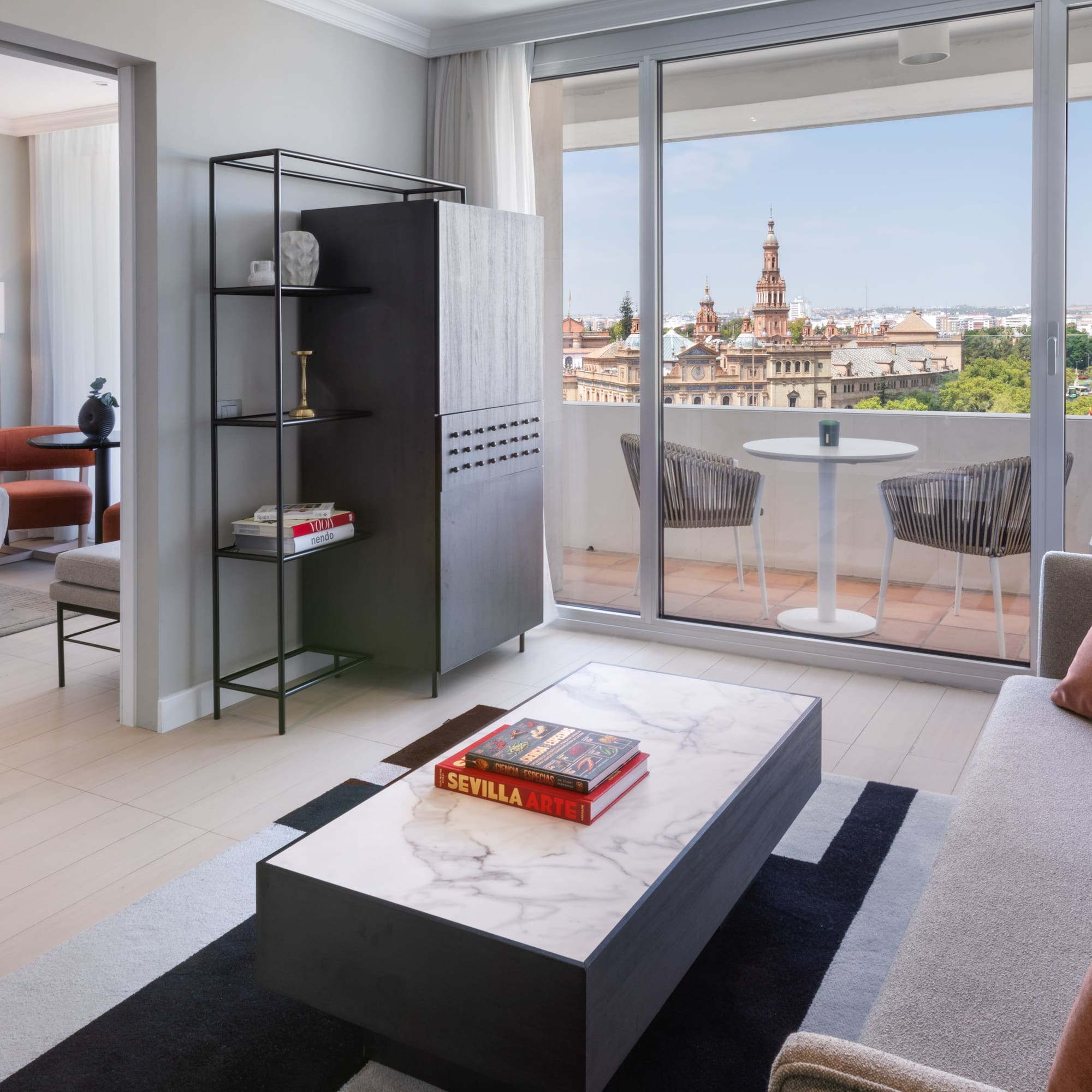 a living room with a table and chairs