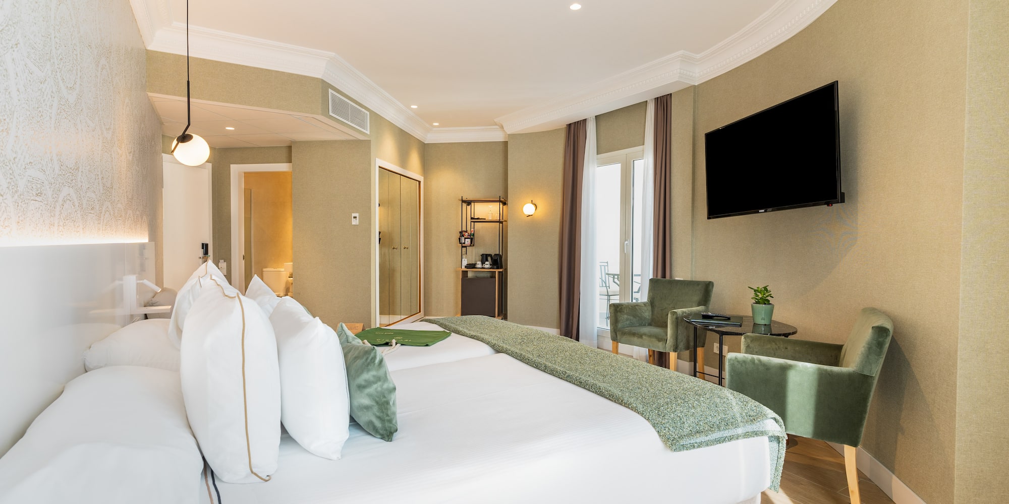 a room with a bed and a television