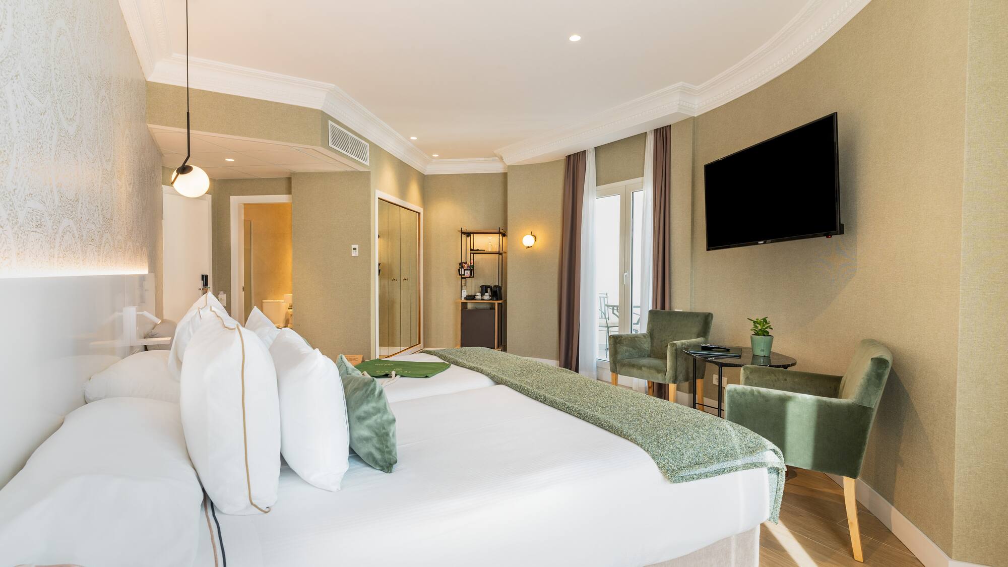 a room with a bed and a television