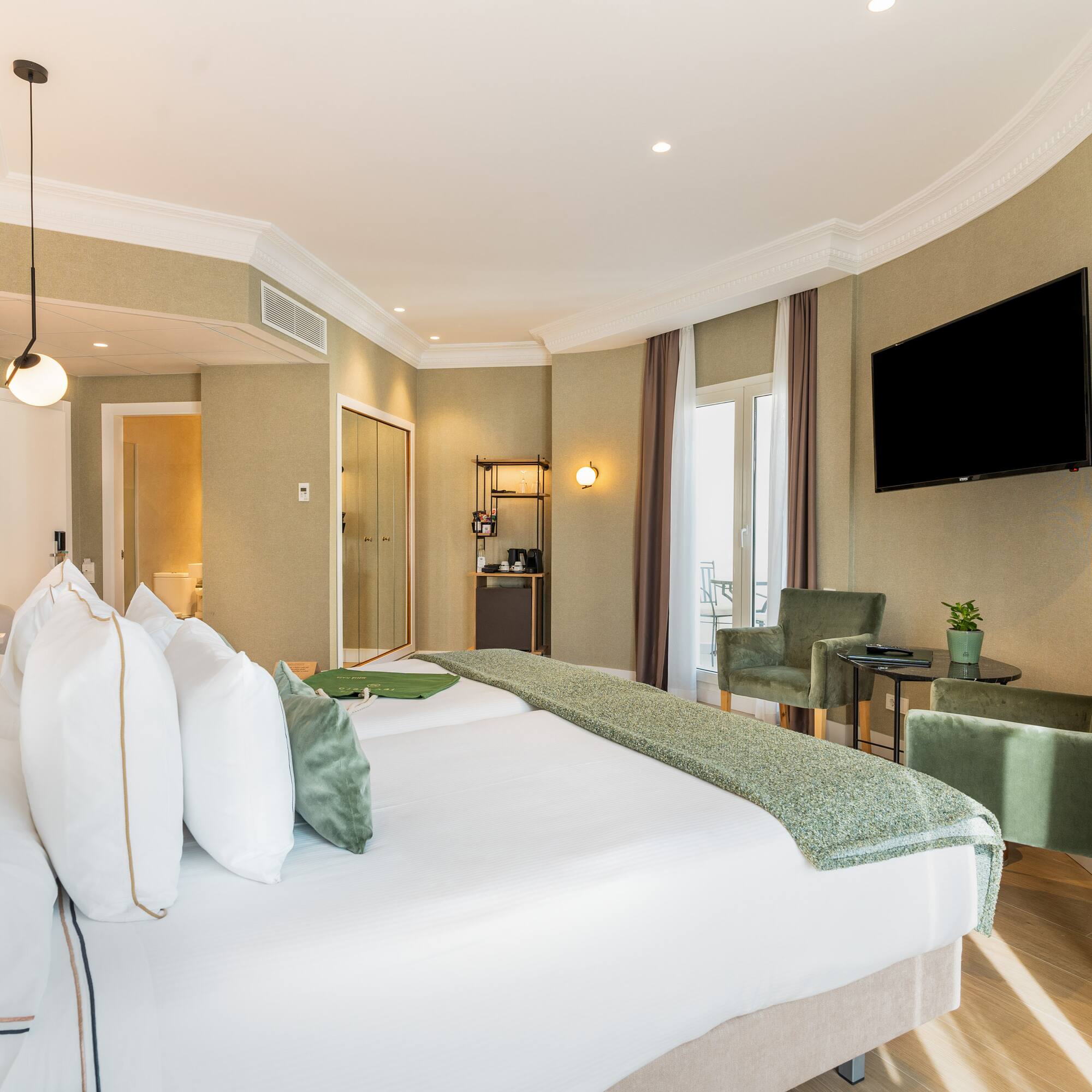 a room with a bed and a television