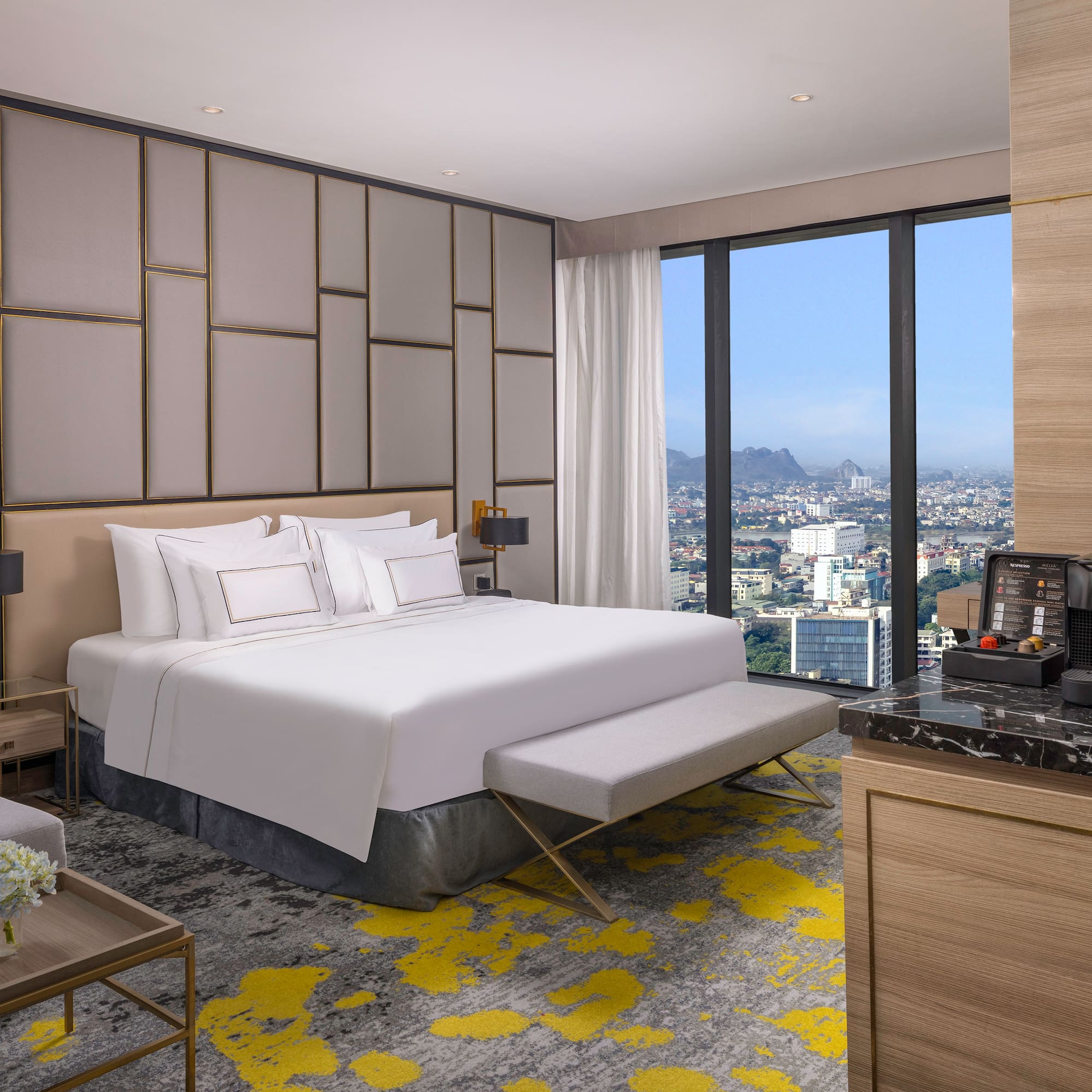 a room with a large bed and a large window