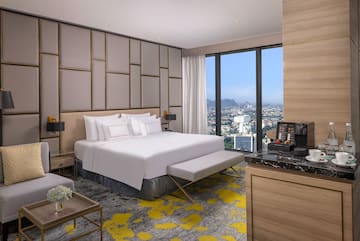 a room with a large bed and a large window