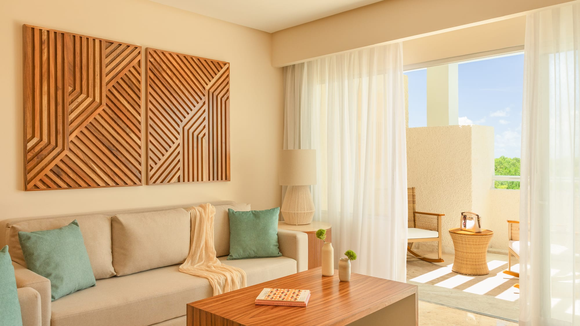 Modern living room with beige sofa, geometric wood art, and bright balcony.