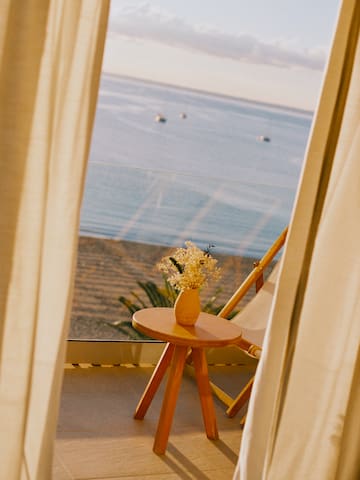 a table with flowers on it by a window