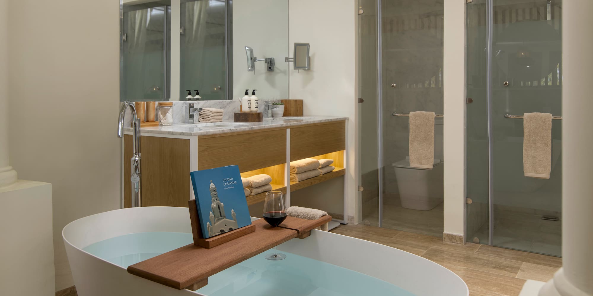 a bathroom with a tub and a glass shower