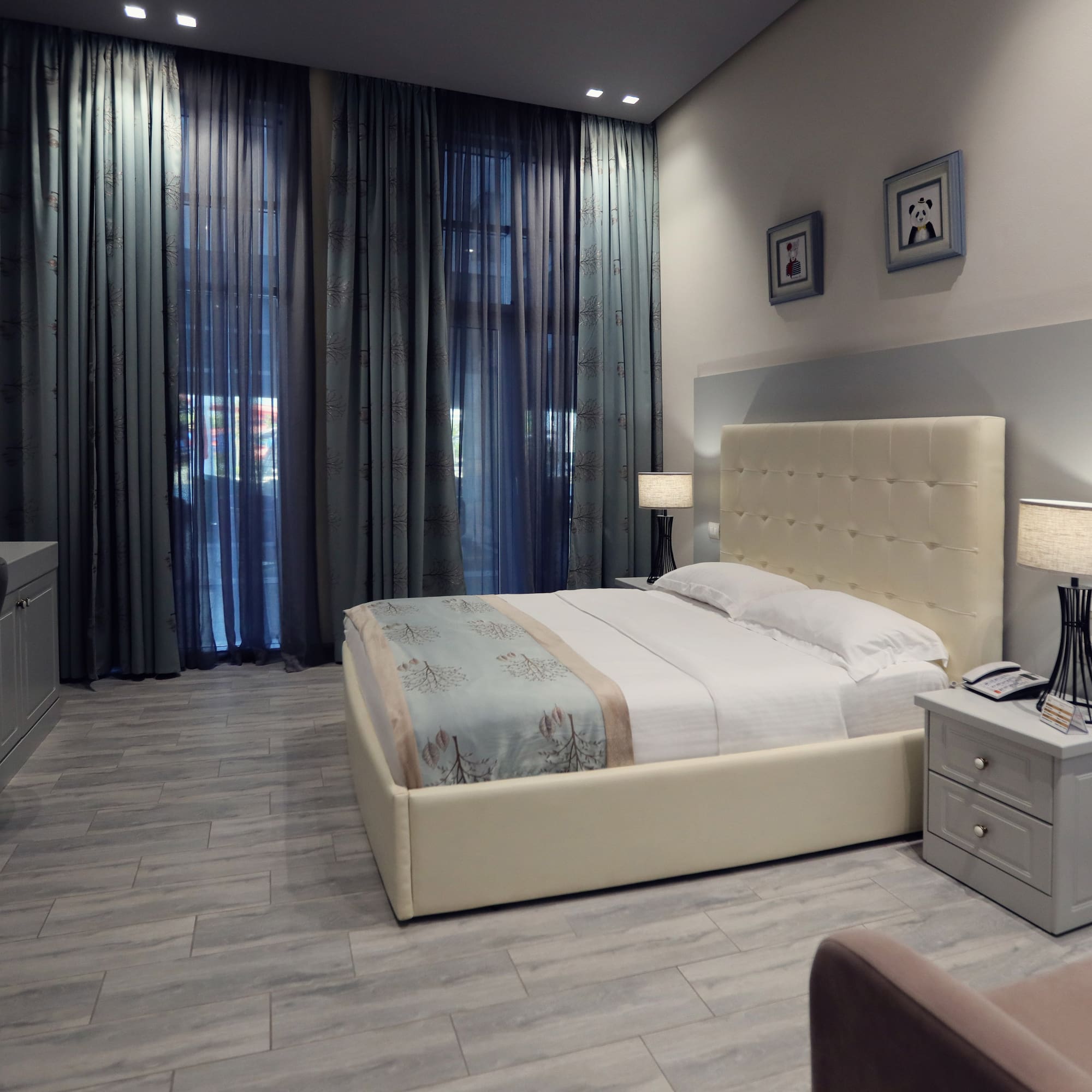 a bedroom with a bed and a dresser