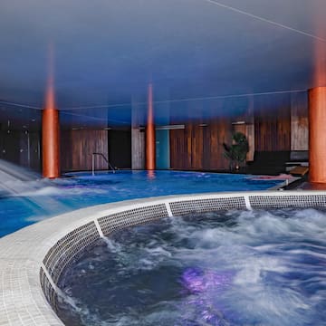 a large indoor jacuzzi with a hot tub
