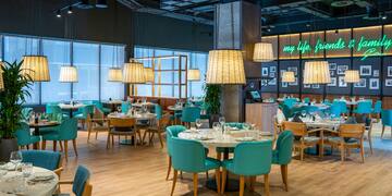 a restaurant with tables and chairs