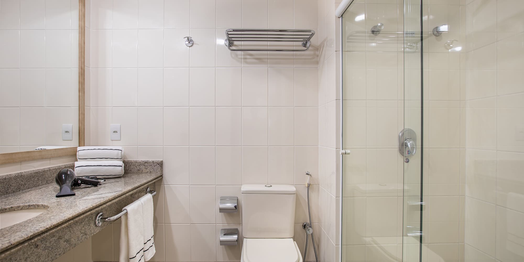 a bathroom with a glass shower door