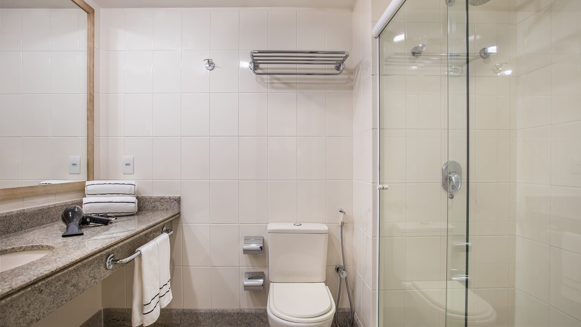 a bathroom with a glass shower door