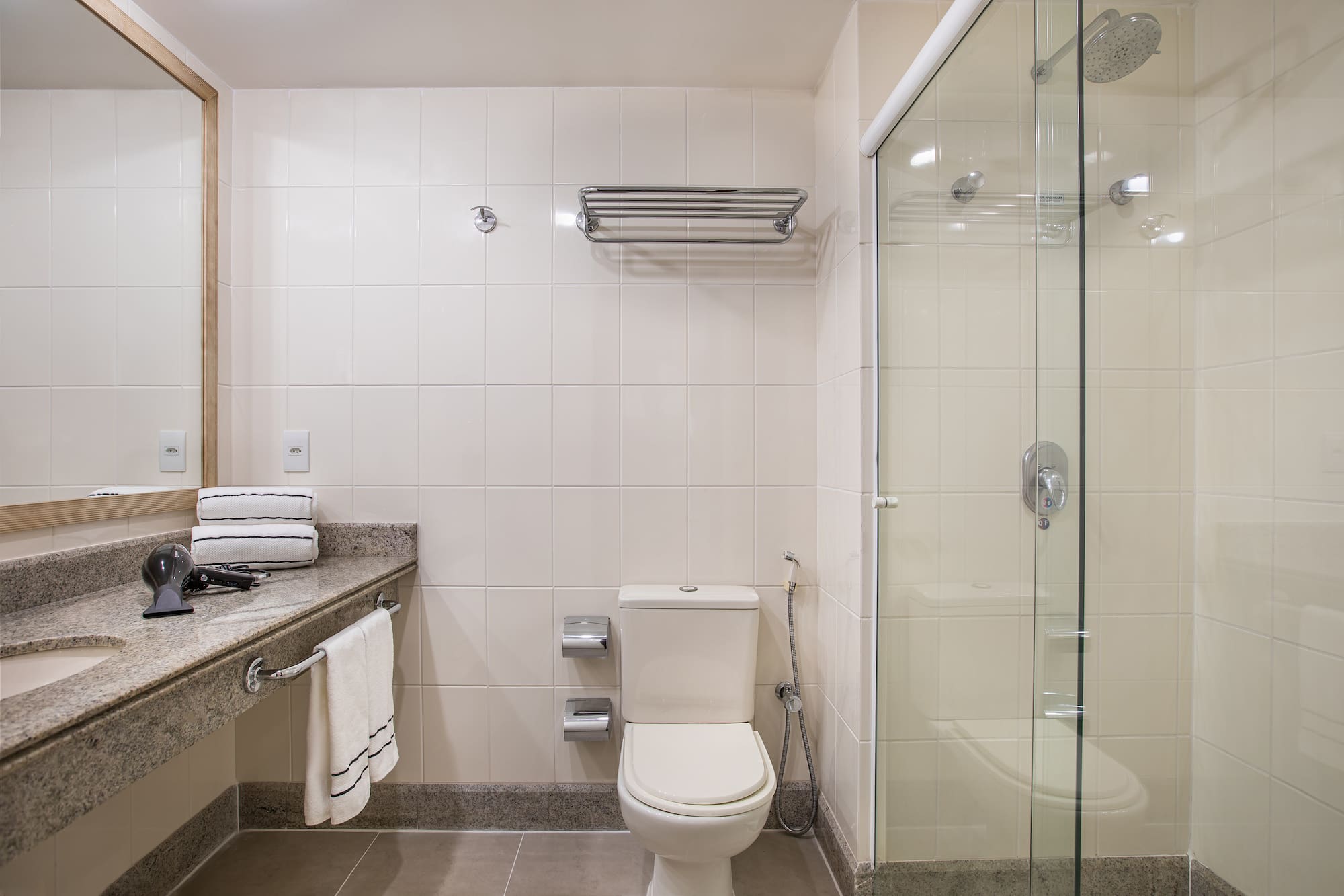 a bathroom with a glass shower door
