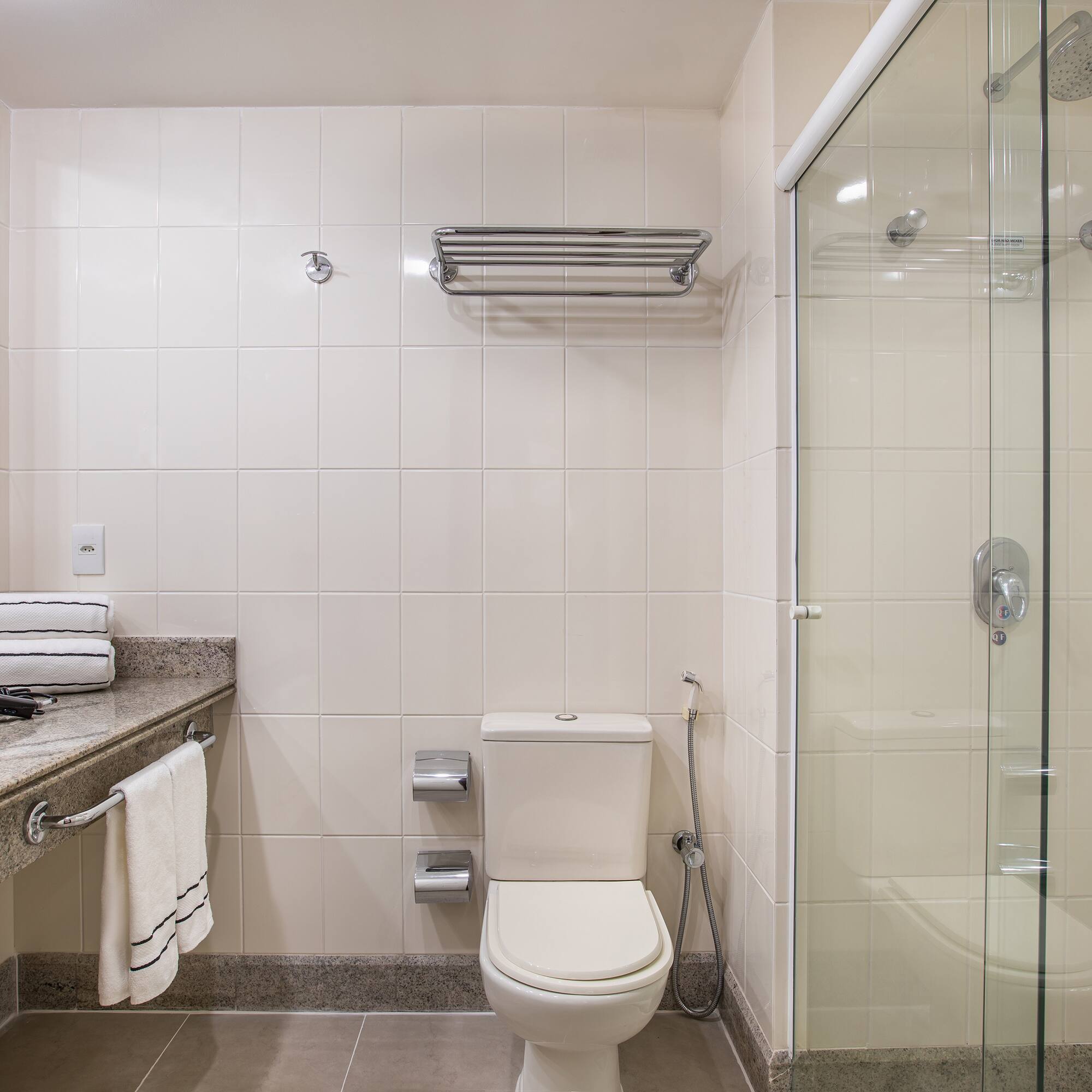 a bathroom with a glass shower door