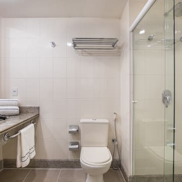 a bathroom with a glass shower door