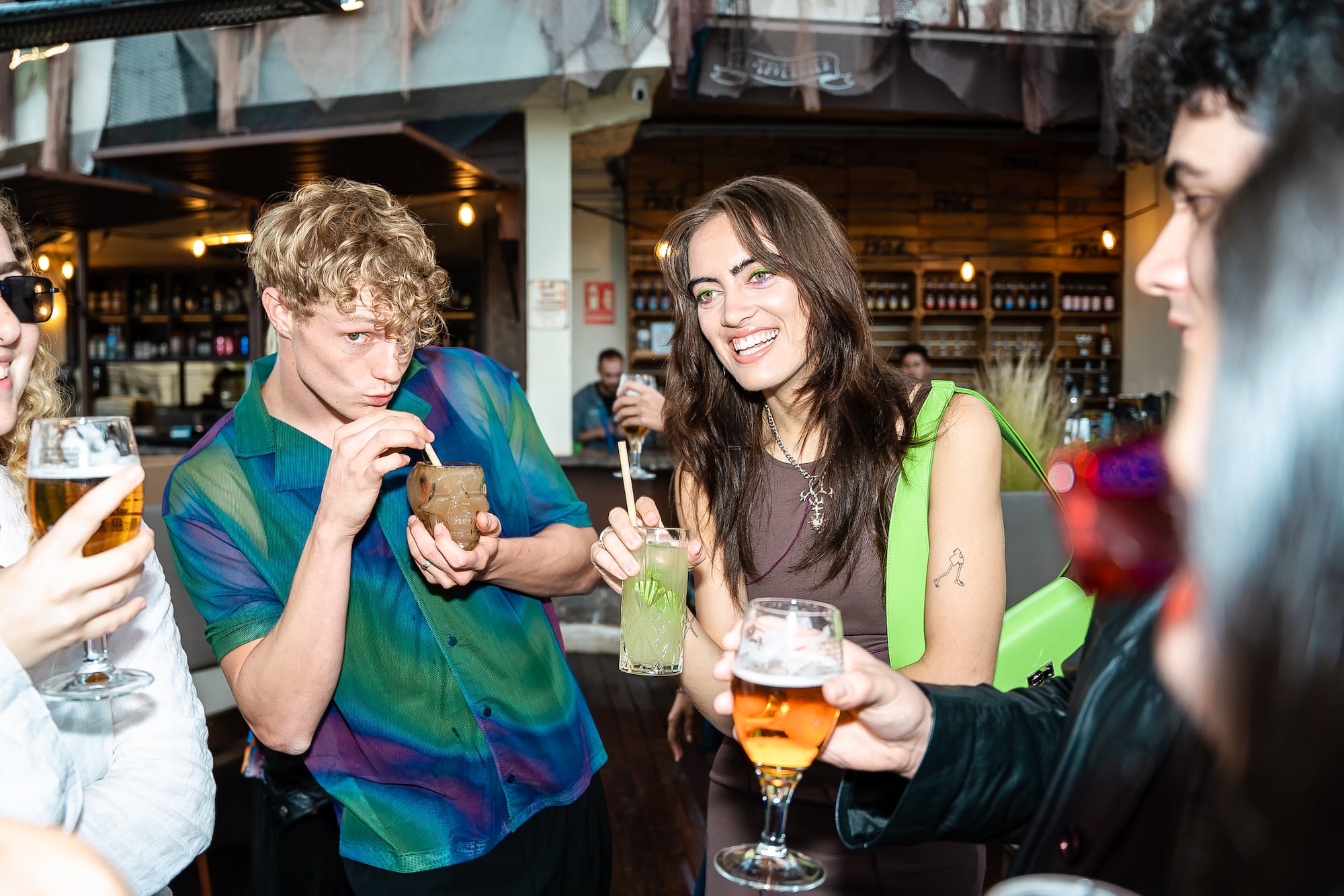 a group of people drinking beverages