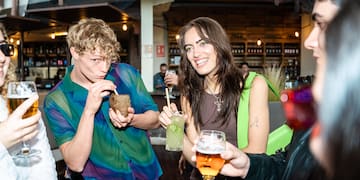 a group of people drinking beverages