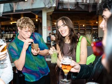 a group of people drinking beverages