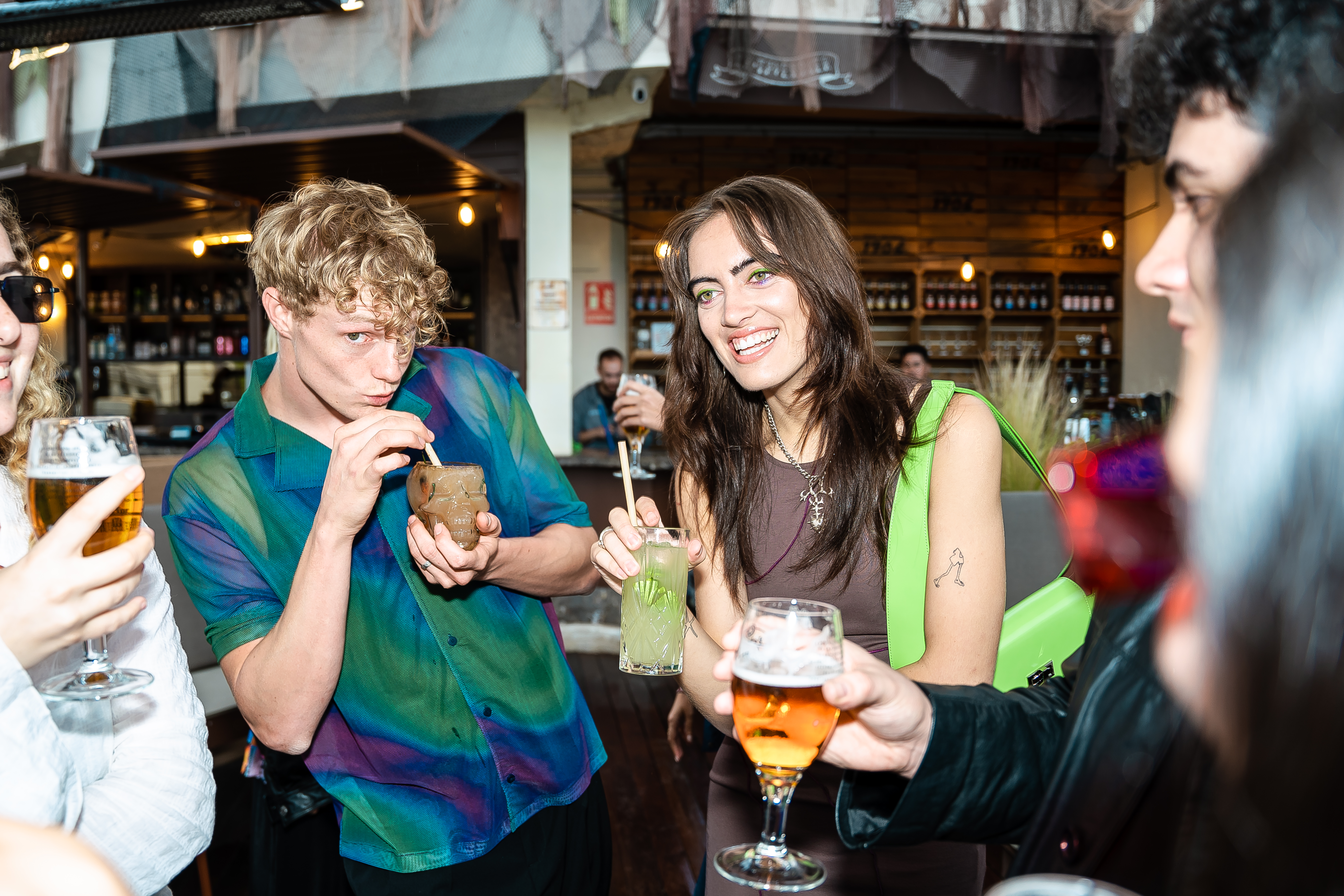a group of people drinking beverages