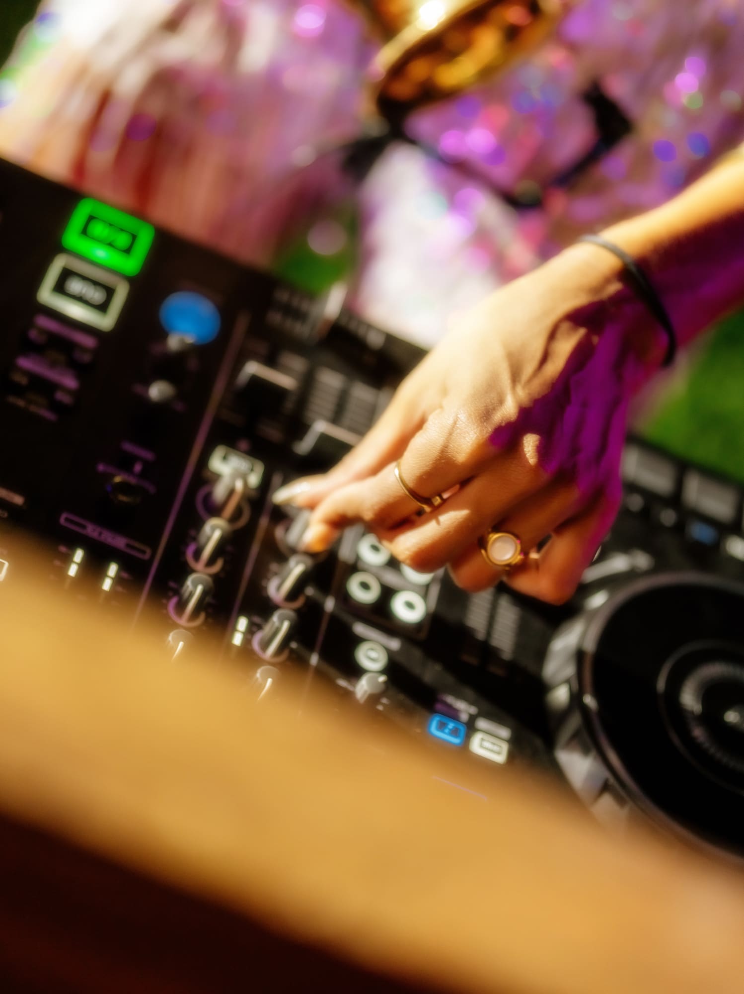 a person playing music on a dj console