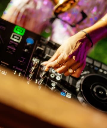 a person playing music on a dj console