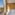Modern hotel room with comfortable bed and scenic city garden view.