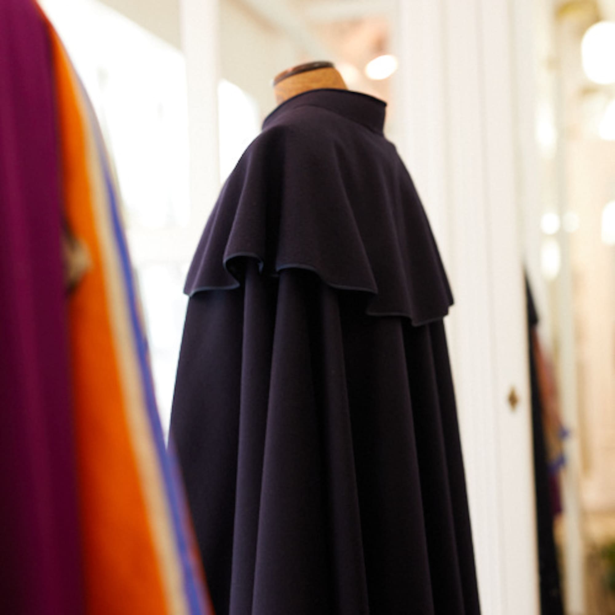 a black cape on a mannequin