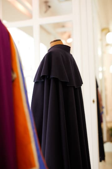 a black cape on a mannequin