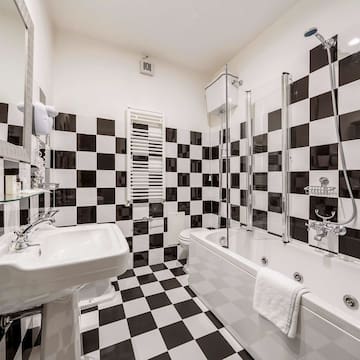 a bathroom with a bathtub and sink