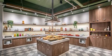 a large kitchen with food on shelves