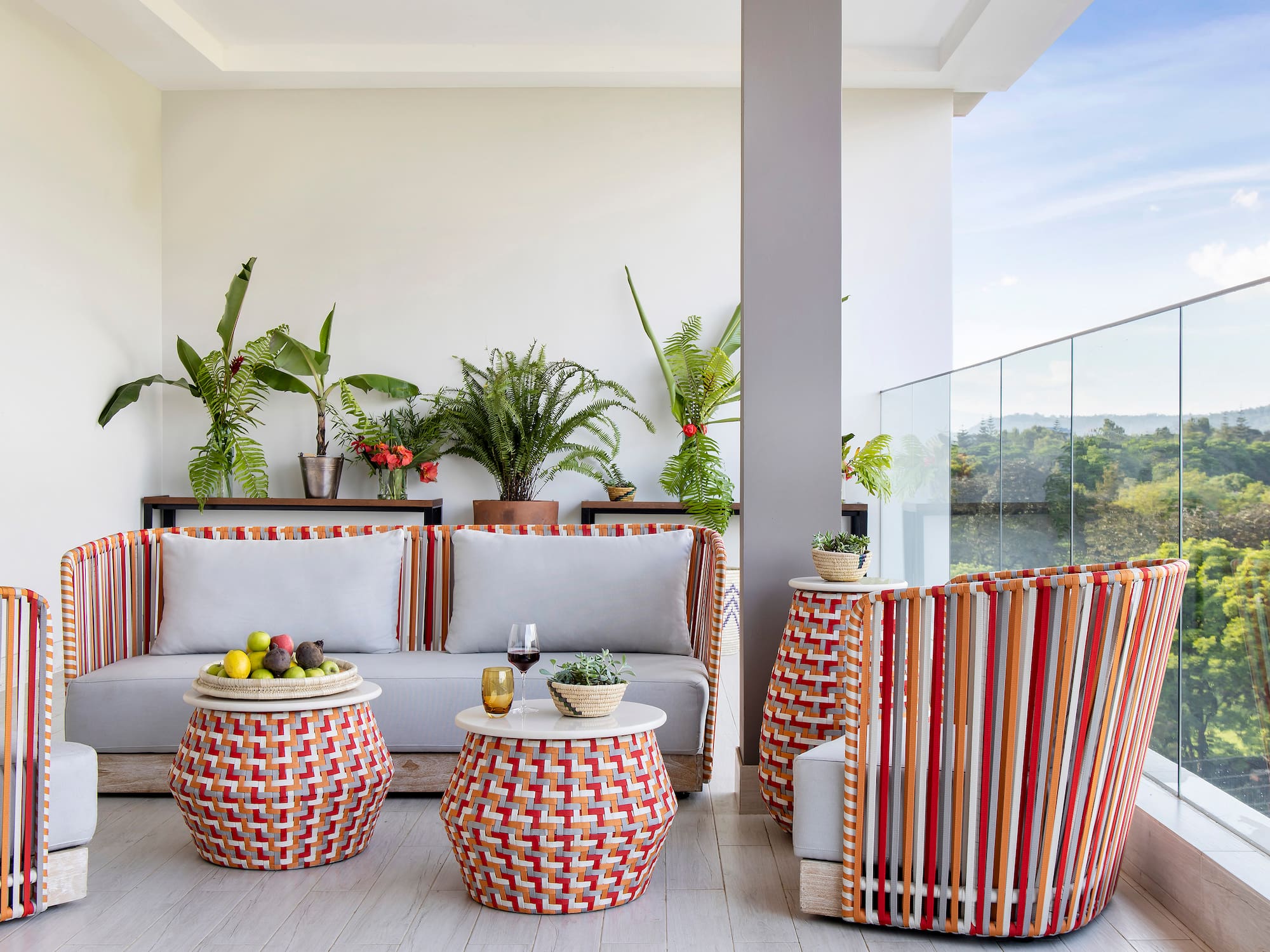 a patio with a couch and chairs
