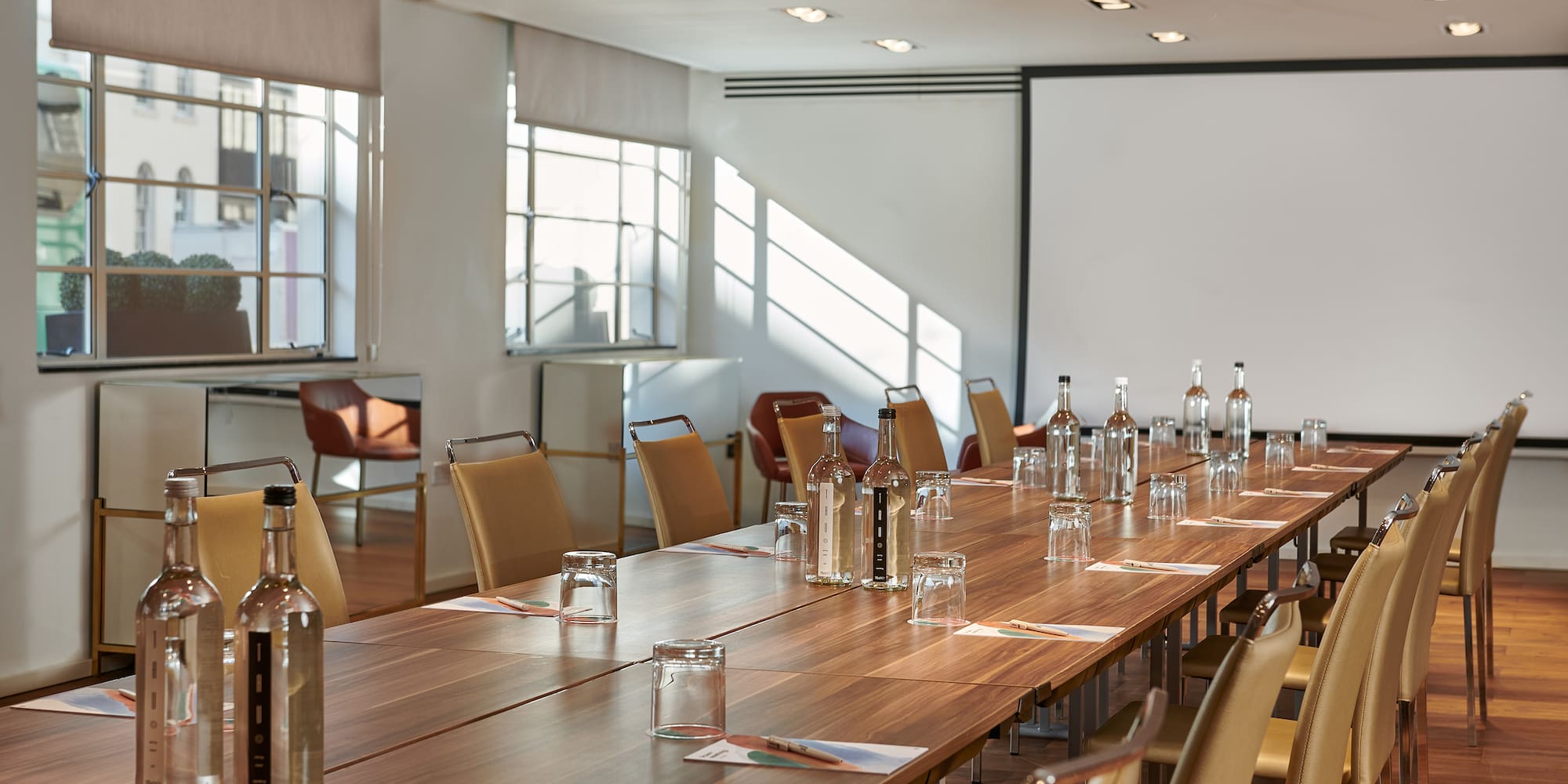 a long table with bottles and glasses on it