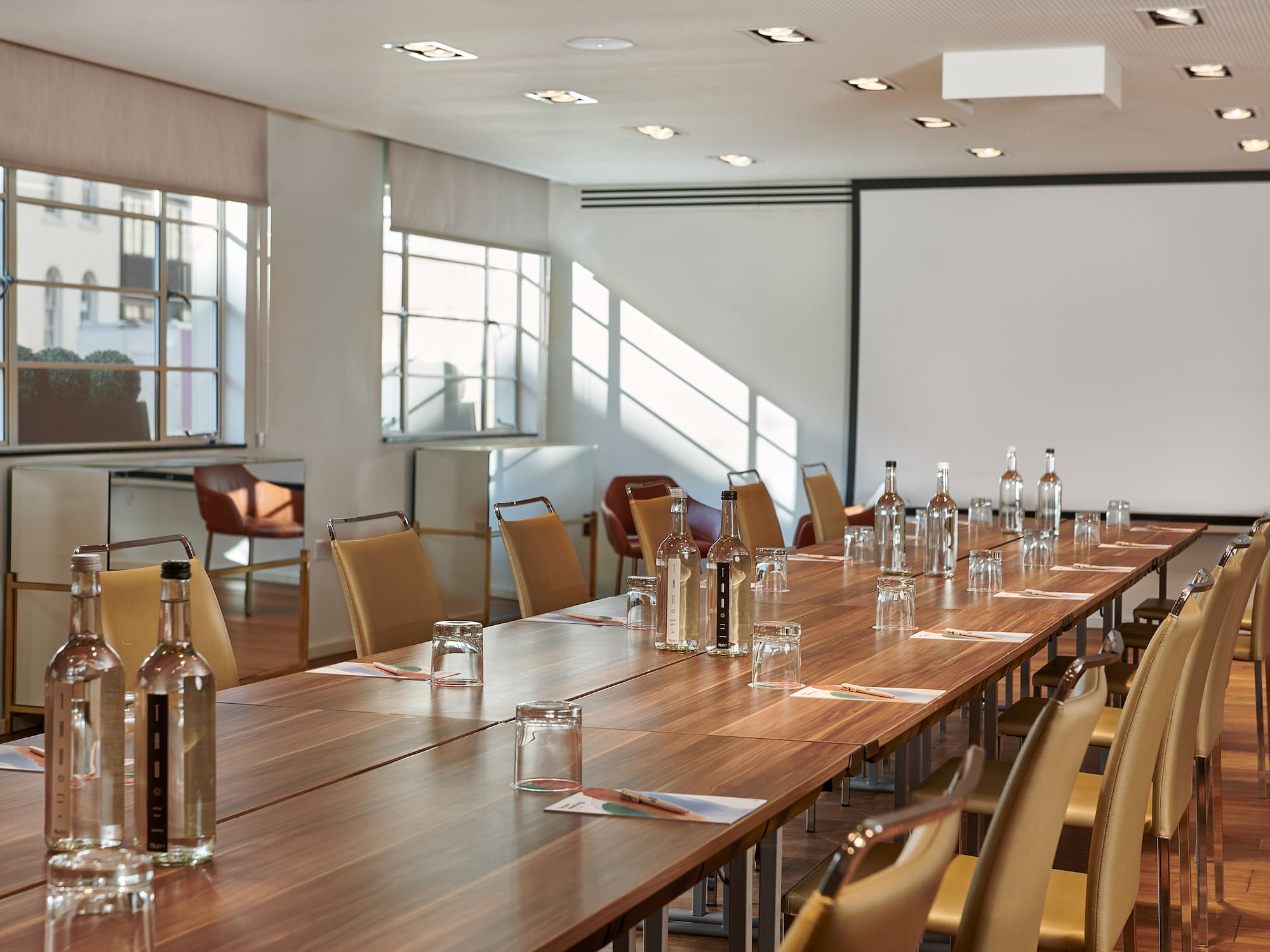 a long table with bottles and glasses on it