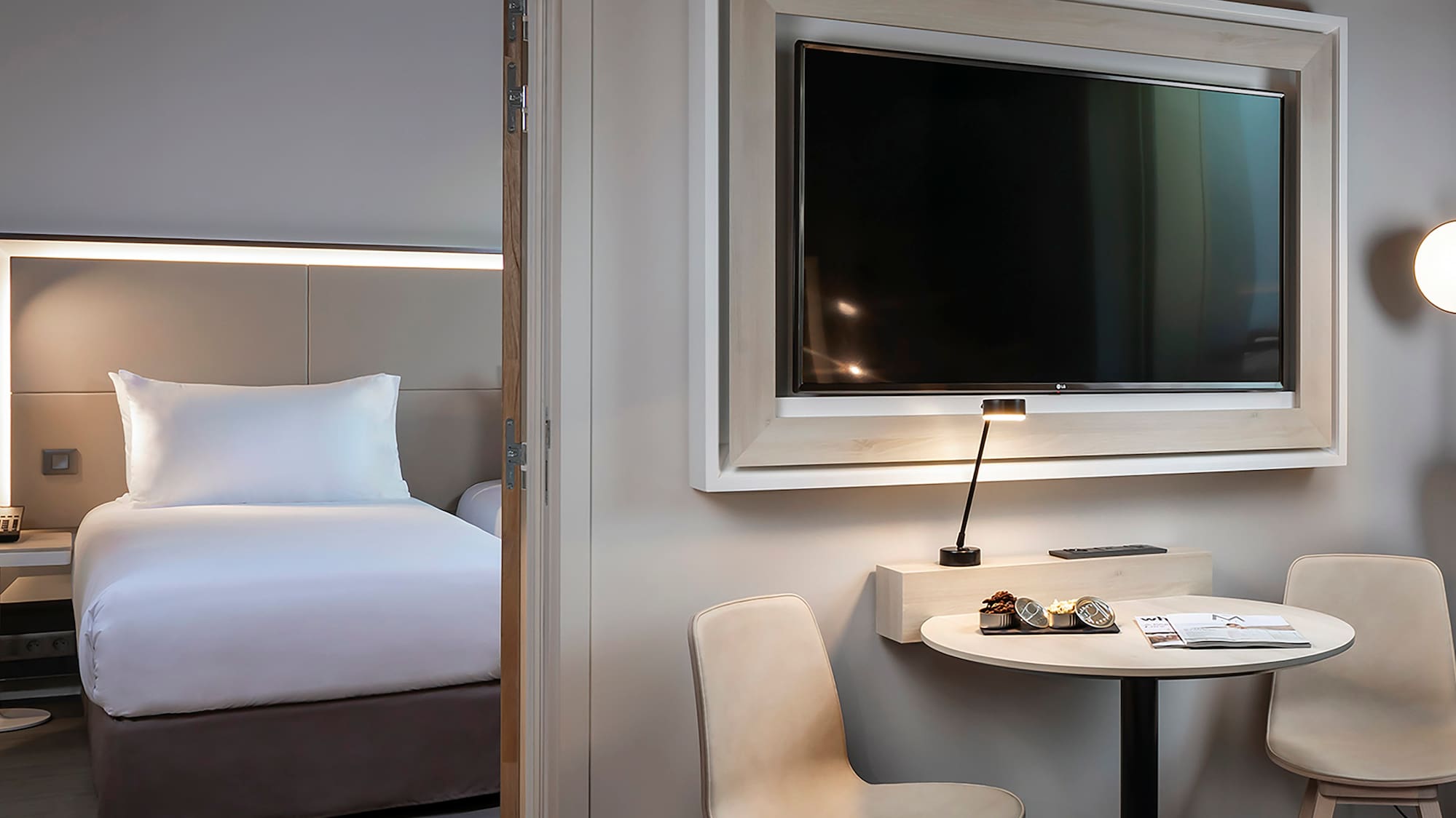 a room with a television and a bed