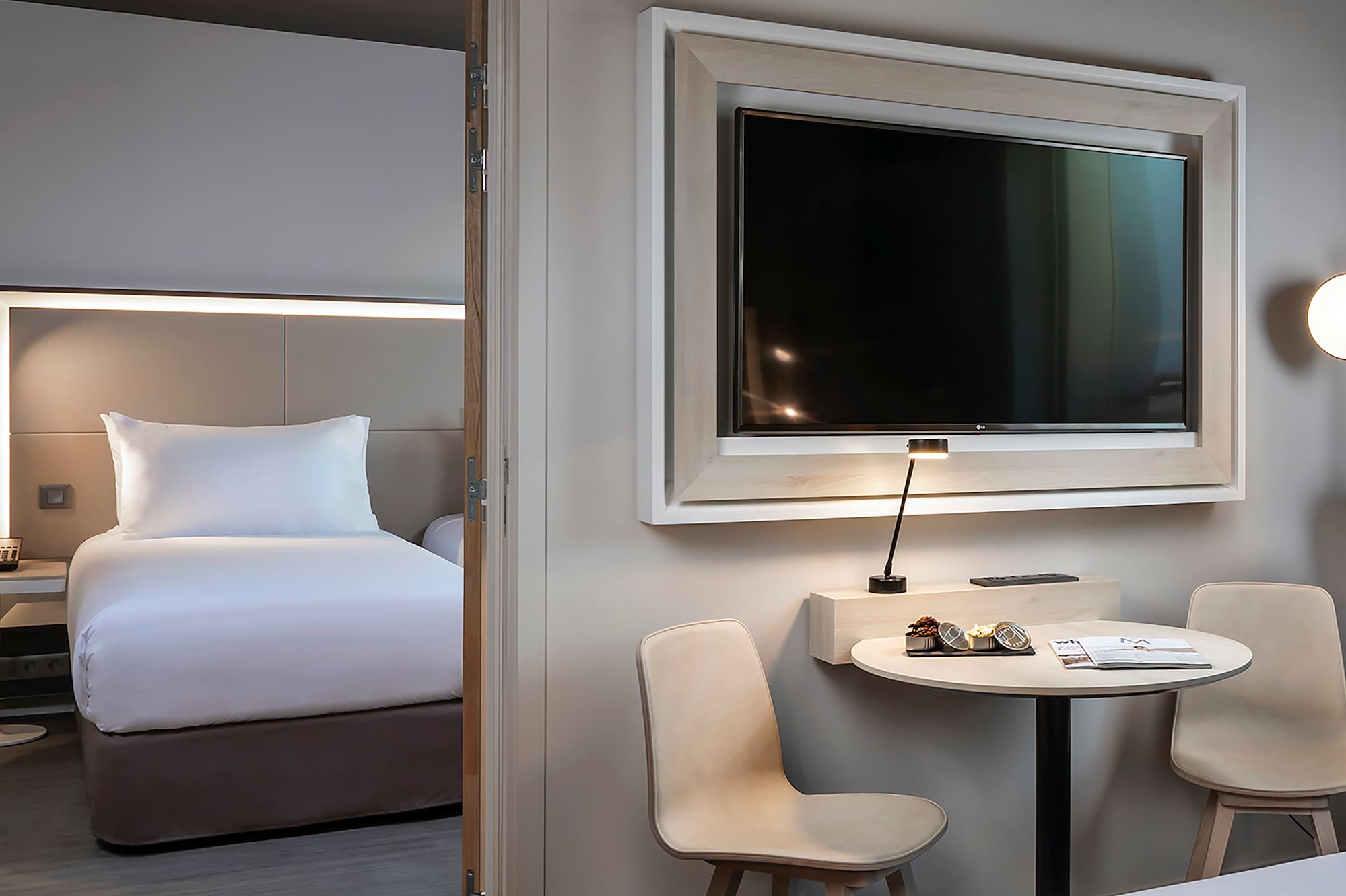 a room with a television and a bed