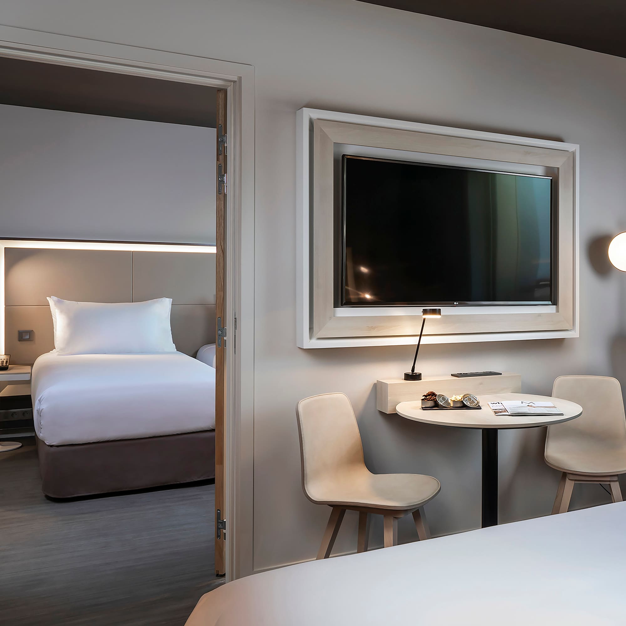 a room with a television and a bed