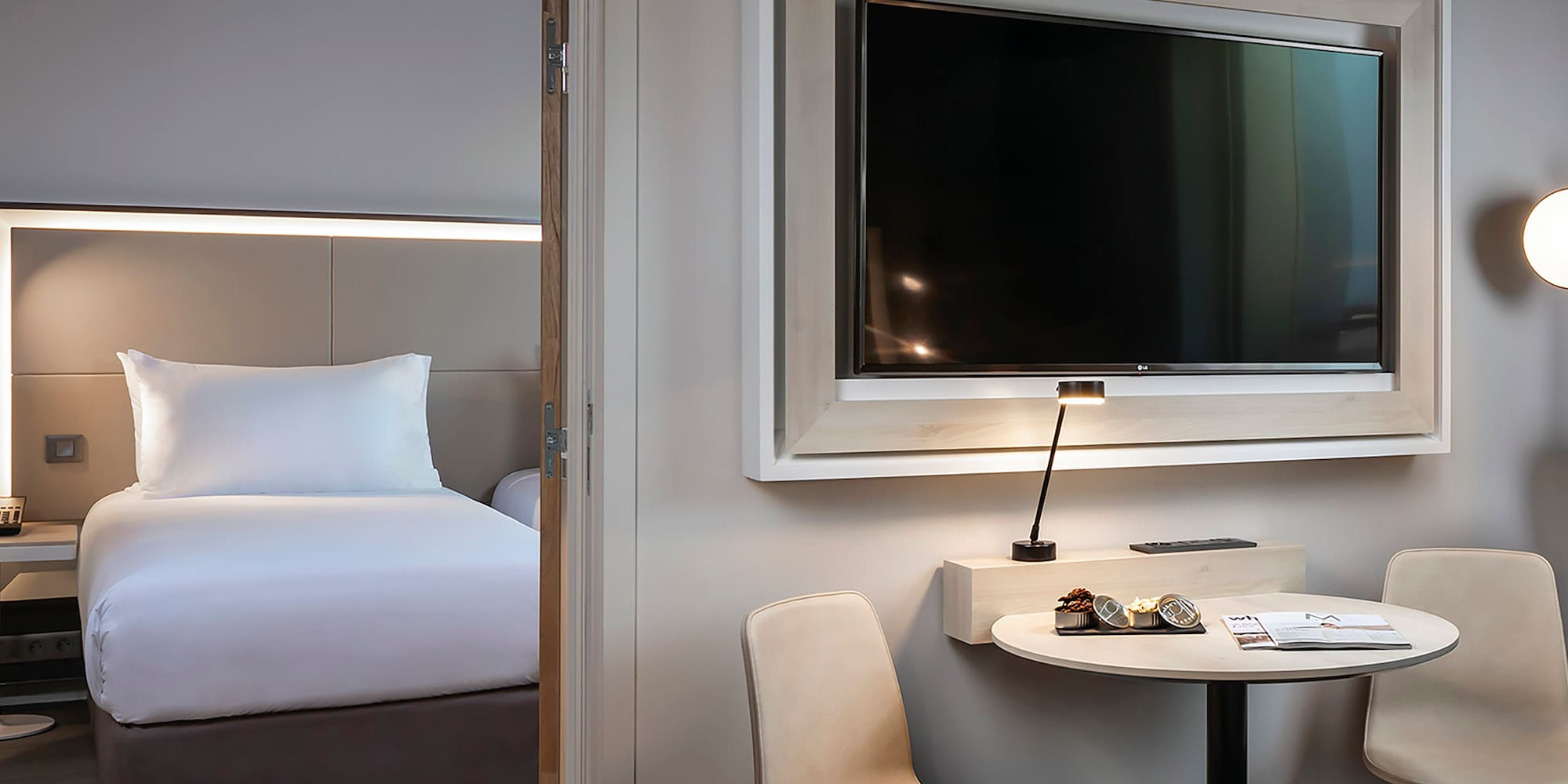 a room with a television and a bed