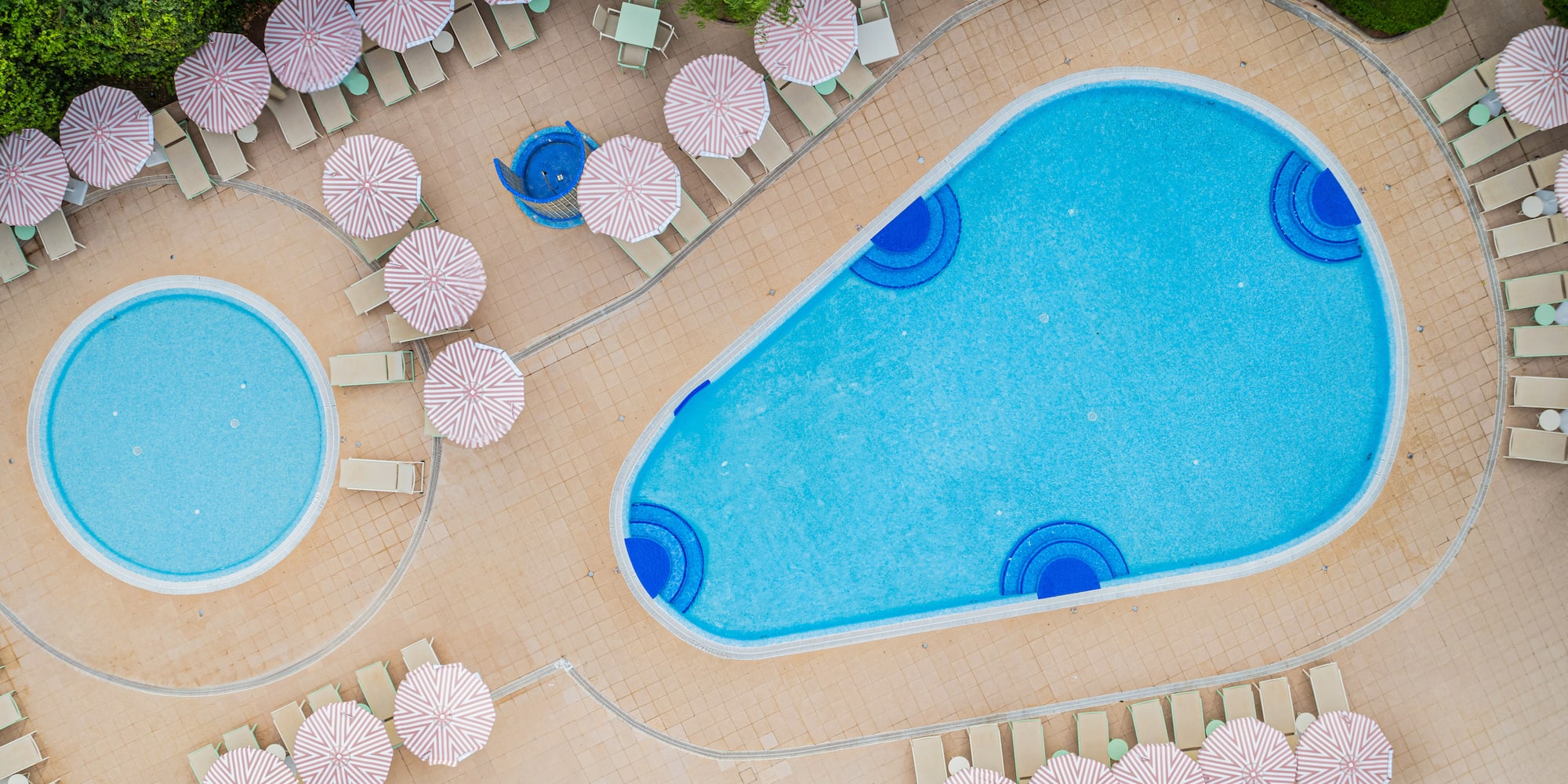 a pool with umbrellas and chairs