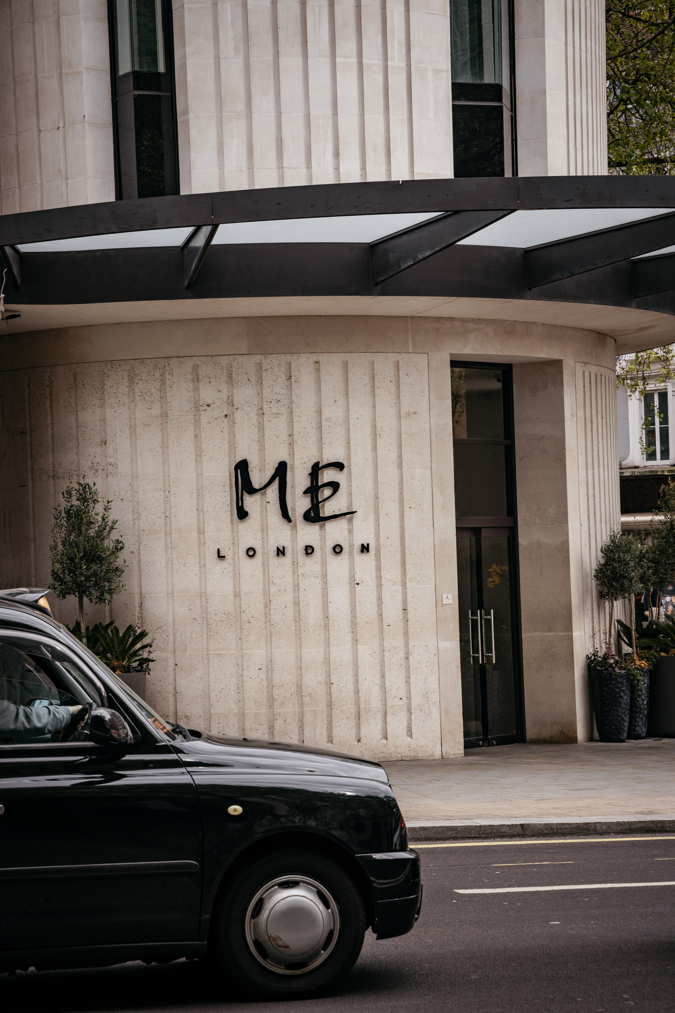 a black car parked in front of a building
