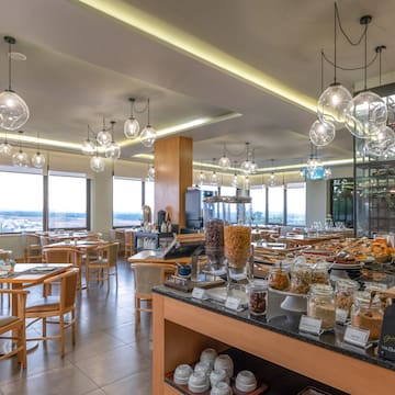 a restaurant with many tables and chairs