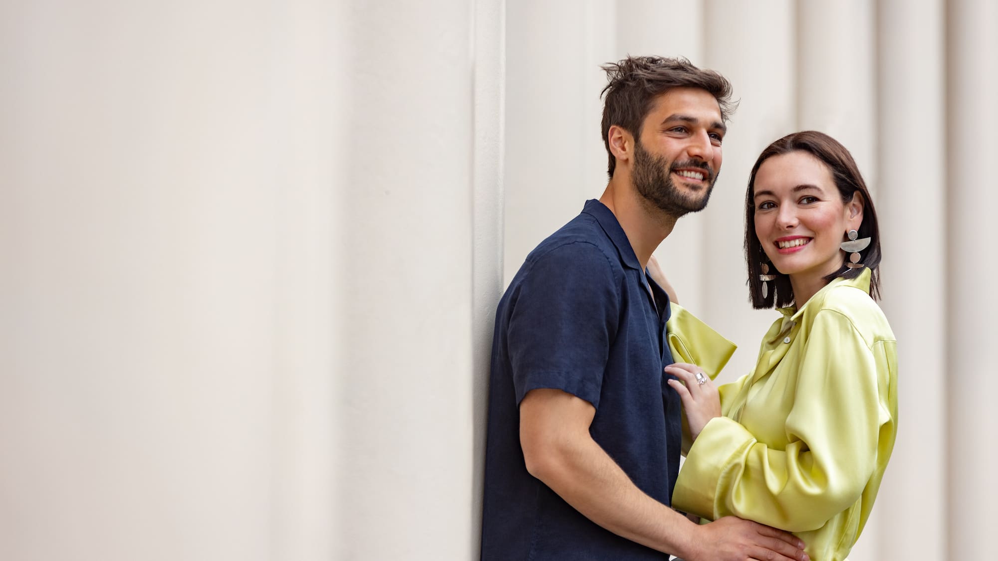 a man and woman standing next to each other